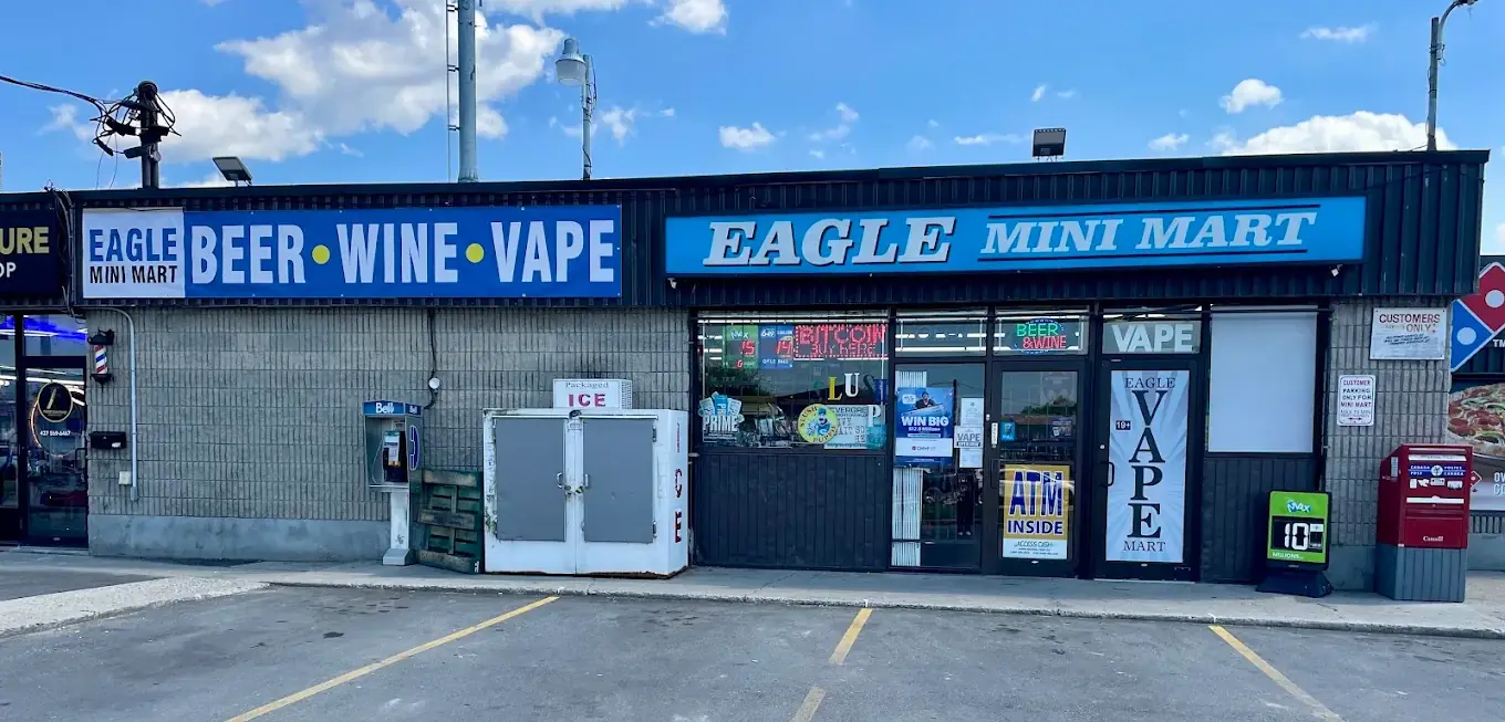 Eagle Mini Mart storefront at 1531 Eagle St N in Cambridge, with the blue Eagle Mini Mart sign over the entrance
